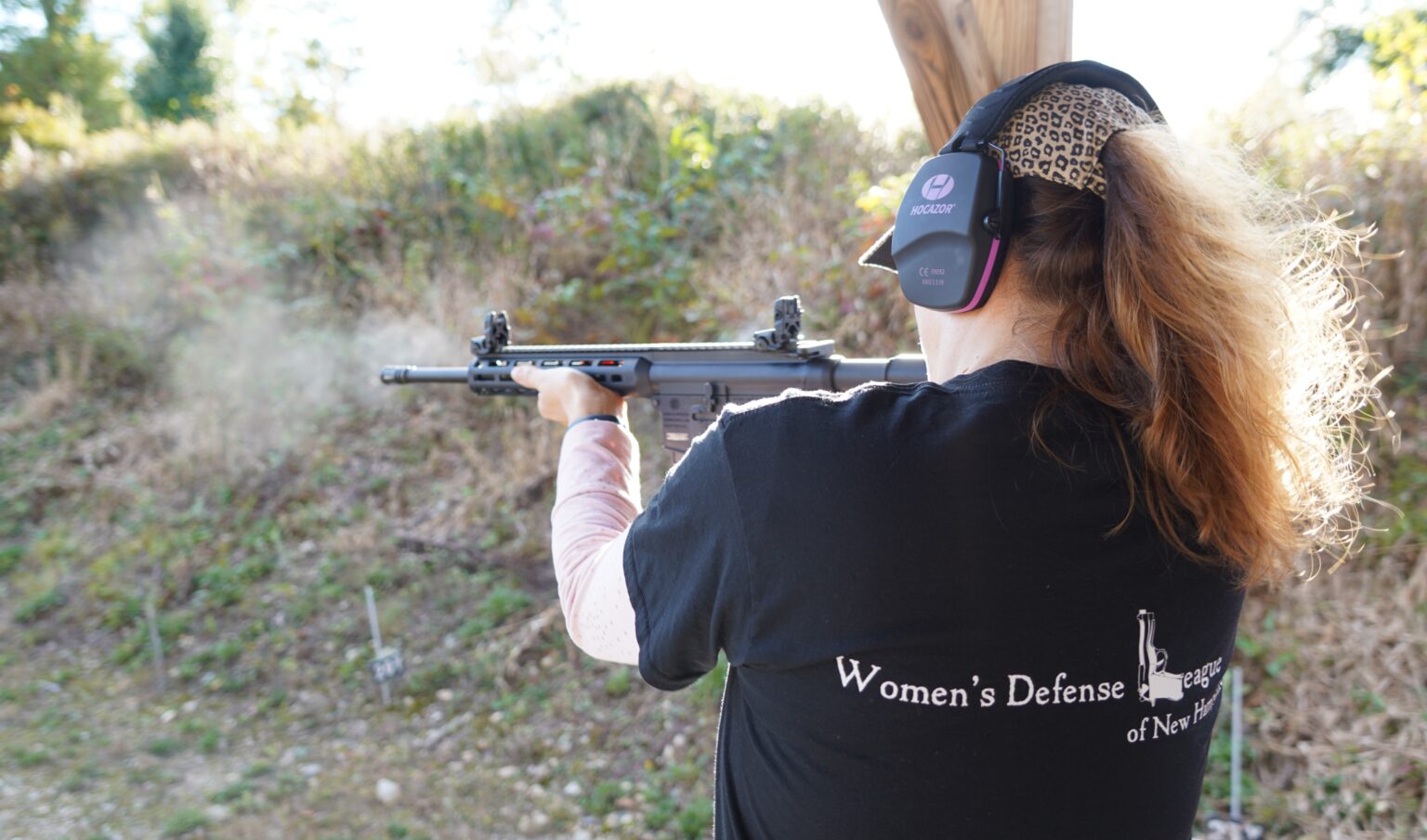 Woman shooting a rifle